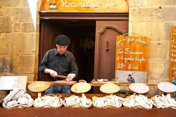 OT SARLAT man at food shop